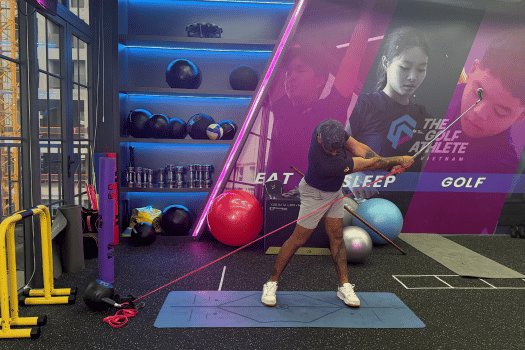 Athlete working with resistance band on a swing pattern